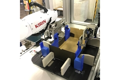 Image Kirin robotic arm assembling a cardboard gift carton in an automated packaging system